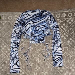 Blue marble top with bell sleeves and cut out tie sides